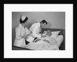 Doctor and nurse checking on elderly male patient in hospital bed by Anonymous