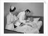 Doctor and nurse checking on elderly male patient in hospital bed by Anonymous