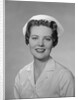 Portrait female nurse smiling by Anonymous