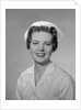 Portrait female nurse smiling by Anonymous