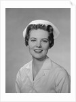 Portrait female nurse smiling by Anonymous