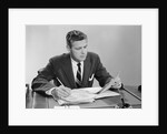 Businessman at desk looking over files papers making notes with pencil by Anonymous