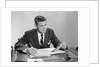 Businessman at desk looking over files papers making notes with pencil by Anonymous