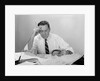 Businessman desk full papers hand to forehead serious expression by Anonymous