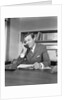 Businessman executive at desk talking on telephone by Anonymous