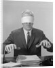 Business man hands hovering over desk wearing blindfold by Anonymous