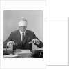 Business man hands hovering over desk wearing blindfold by Anonymous