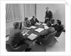 6 executive businessmen around conference table board meeting by Anonymous