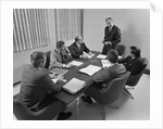 6 executive businessmen around conference table board meeting by Anonymous