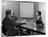 Three executive businessmen conference table audiovisual presentation by Anonymous
