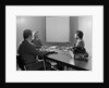 Three executive businessmen conference table audiovisual presentation by Anonymous