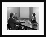 Three executive businessmen conference table audiovisual presentation by Anonymous