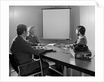 Three executive businessmen conference table audiovisual presentation by Anonymous