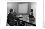 Three executive businessmen conference table audiovisual presentation by Anonymous