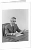 Businessman executive middle aged sitting at desk reading papers by Anonymous