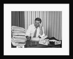 Concerned businessman staring large pile paperwork in in-box by Anonymous