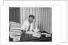 Concerned businessman staring large pile paperwork in in-box by Anonymous