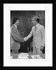 Two businessmen shaking hands handshake by Anonymous