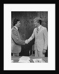 Two businessmen shaking hands handshake by Anonymous