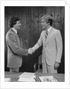 Two businessmen shaking hands handshake by Anonymous