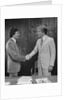 Two businessmen shaking hands handshake by Anonymous