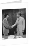 Two businessmen shaking hands handshake by Anonymous