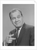 Portrait man pointing wearing suit tie smiling by Anonymous