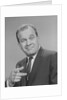 Portrait man pointing wearing suit tie smiling by Anonymous