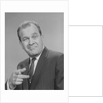 Portrait man pointing wearing suit tie smiling by Anonymous
