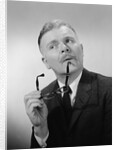 Serious thinking thoughtful older man holding eyeglasses to chin by Anonymous