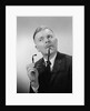 Serious thinking thoughtful older man holding eyeglasses to chin by Anonymous