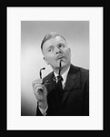Serious thinking thoughtful older man holding eyeglasses to chin by Anonymous