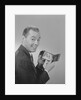 Man smiling holding wallet showing photo of family by Anonymous