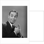 Man punching his fist into his palm with satisfied expression by Anonymous