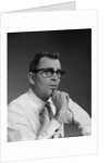 Man thinking hand pencil on chin wearing eyeglasses serious expression by Anonymous