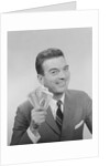 Smiling man holding a fistful of money fake bills by Anonymous