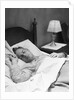Man sleeping asleep in bedroom by Anonymous
