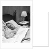 Man sleeping asleep in bedroom by Anonymous