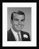 Smiling young man formal attire boutonniere in lapel bridegroom groom by Anonymous