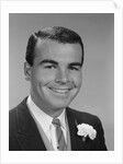 Smiling young man formal attire boutonniere in lapel bridegroom groom by Anonymous
