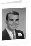 Smiling young man formal attire boutonniere in lapel bridegroom groom by Anonymous