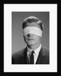 Young man wearing blindfold by Anonymous