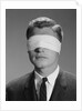 Young man wearing blindfold by Anonymous