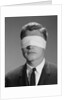 Young man wearing blindfold by Anonymous