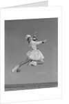 Woman majorette wearing band uniform holding baton jumping into the air by Anonymous