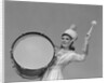 Smiling young woman band uniform carrying playing big drum by Anonymous
