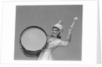 Smiling young woman band uniform carrying playing big drum by Anonymous