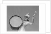 Smiling young woman band uniform carrying playing big drum by Anonymous