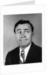 Businessman making funny face looking to the side by Anonymous
