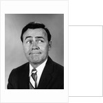 Businessman making funny face looking to the side by Anonymous